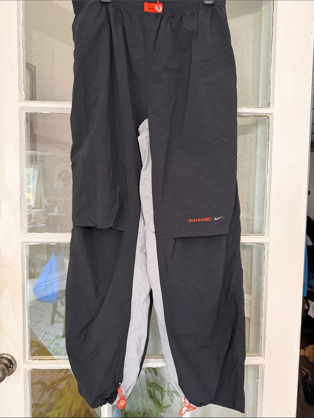 Nike Black Joggers with Gray Panels and Orange Accents